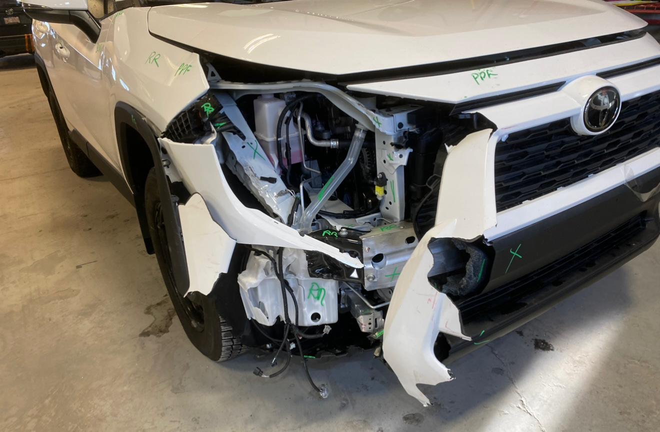 SUV front-end damage before collision repair