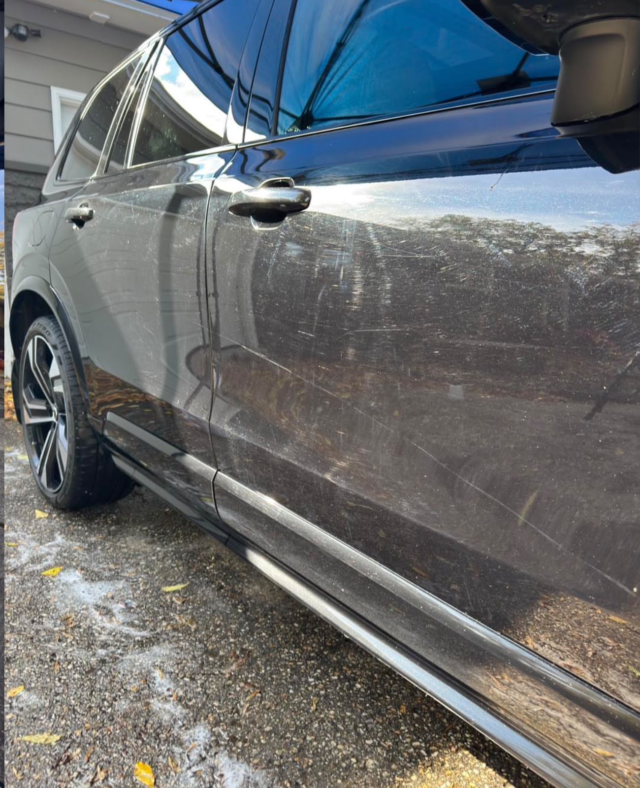 Black SUV door before ceramic coating